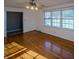 Living room with hardwood floors and access to another room at 940 Valley Dr, Newton, NC 28658