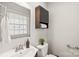 Small bathroom with a toilet, sink, and vanity at 941 Squirrel Hill Rd, Charlotte, NC 28213