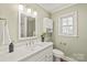 Updated bathroom with white vanity and modern fixtures at 941 Squirrel Hill Rd, Charlotte, NC 28213