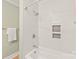 Updated bathroom with herringbone tile shower and tub at 941 Squirrel Hill Rd, Charlotte, NC 28213