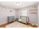 Charming bedroom with hardwood floors and neutral walls at 941 Squirrel Hill Rd, Charlotte, NC 28213