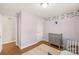 Light and bright bedroom with hardwood floors and neutral walls at 941 Squirrel Hill Rd, Charlotte, NC 28213