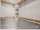 Spacious walk-in closet with ample shelving and hanging rods at 941 Squirrel Hill Rd, Charlotte, NC 28213