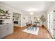 Bright dining room features hardwood floors and a view into the kitchen at 941 Squirrel Hill Rd, Charlotte, NC 28213