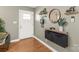 Bright entryway with wood floors and a custom floating shelf at 941 Squirrel Hill Rd, Charlotte, NC 28213