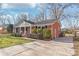 Brick ranch house with a well-maintained front yard at 941 Squirrel Hill Rd, Charlotte, NC 28213