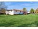 Backyard view showing a deck and expansive lawn at 9938 Sandra Ln, Fort Mill, SC 29707