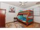 Bedroom with a wooden bunk bed and teal bedding at 9938 Sandra Ln, Fort Mill, SC 29707