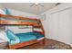 Bedroom featuring a wooden bunk bed and teal bedding at 9938 Sandra Ln, Fort Mill, SC 29707