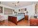 Main bedroom with a wooden sleigh bed and light blue bedding at 9938 Sandra Ln, Fort Mill, SC 29707