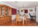 Dining room with hardwood floors, a table, and a built-in hutch at 9938 Sandra Ln, Fort Mill, SC 29707