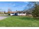 Ranch style home with red shutters, spacious lawn, and driveway at 9938 Sandra Ln, Fort Mill, SC 29707