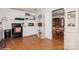 Kitchen with white cabinets, black appliances, and wood flooring at 9938 Sandra Ln, Fort Mill, SC 29707