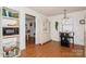 Eat-in kitchen area with white cabinets, a microwave, and a small table at 9938 Sandra Ln, Fort Mill, SC 29707