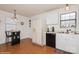 Kitchen with white cabinets, black appliances, and a breakfast bar at 9938 Sandra Ln, Fort Mill, SC 29707