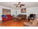 Spacious living room with hardwood floors, comfy seating, and a coffee table at 9938 Sandra Ln, Fort Mill, SC 29707