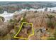 Lakefront property with a large lot and wooded area at 102 Serene St, Mount Gilead, NC 27306