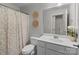 Clean bathroom with a shower/tub combo, toilet, and white vanity at 102 Serene St, Mount Gilead, NC 27306