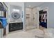 Bathroom with walk-in shower, soaking tub, and double vanity at 102 Serene St, Mount Gilead, NC 27306