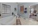Bathroom with corner soaking tub and bedroom view at 102 Serene St, Mount Gilead, NC 27306