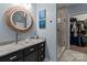 Modern bathroom with a large vanity, glass shower, and walk-in closet at 102 Serene St, Mount Gilead, NC 27306