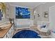 Well-lit Bedroom with a crib, rocking chair, and large wall art at 102 Serene St, Mount Gilead, NC 27306
