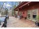Large deck with stone pillars, seating area, and built-in grill at 102 Serene St, Mount Gilead, NC 27306