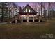 A charming A-frame home with a spacious deck and stone accents at 102 Serene St, Mount Gilead, NC 27306