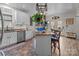 Modern kitchen with white cabinets, granite counters, and stainless steel appliances at 102 Serene St, Mount Gilead, NC 27306
