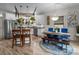 Bright kitchen features an island, stainless steel appliances, and stylish pendant lighting at 102 Serene St, Mount Gilead, NC 27306