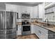 Modern kitchen with stainless steel appliances and granite countertops at 102 Serene St, Mount Gilead, NC 27306