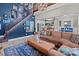 Open concept living area features a comfortable couch and access to the kitchen at 102 Serene St, Mount Gilead, NC 27306
