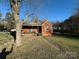 Brick ranch house with front porch and yard at 114 Barker Rd, Dallas, NC 28034