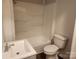 Bathroom with tub, toilet, and sink with gray vanity at 1302 Brookdale St, Kannapolis, NC 28083