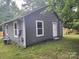 Side view of gray house showing additional exterior features at 1302 Brookdale St, Kannapolis, NC 28083
