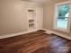 Living room with wood-look flooring and built-in shelving at 1302 Brookdale St, Kannapolis, NC 28083