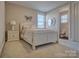 Bedroom with a white bed frame and en-suite bathroom at 13204 Feale Ct, Charlotte, NC 28278