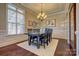 Formal dining room with chandelier and hardwood floors at 13204 Feale Ct, Charlotte, NC 28278