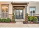 Double front doors with sidelights and stone surround at 13204 Feale Ct, Charlotte, NC 28278