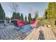 Relaxing patio seating area with red chairs and blue rug at 13204 Feale Ct, Charlotte, NC 28278