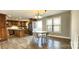 Open concept dining area adjacent to the kitchen with hardwood floors and natural light, perfect for Gathering meals at 1592 Farmington Hills Dr, Conover, NC 28613