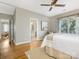 Main bedroom with hardwood floors, ceiling fan, and access to bathroom at 1716 Truman Rd, Charlotte, NC 28205