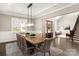 Formal dining room with wood table, chandelier, and hardwood floors at 2010 Belle Grove Dr, Marvin, NC 28173