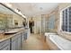 Luxurious bathroom with soaking tub, walk-in shower, and double vanity at 2087 Yellowstone Dr, Fort Mill, SC 29707