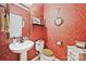 Charming half bathroom with decorative wallpaper and wood flooring at 2087 Yellowstone Dr, Fort Mill, SC 29707