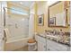 Clean bathroom with granite countertop, large mirror, and a tub at 2087 Yellowstone Dr, Fort Mill, SC 29707