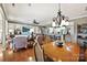 Bright dining area with hardwood floors and open concept to kitchen and living room at 2087 Yellowstone Dr, Fort Mill, SC 29707