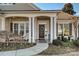 Inviting front porch with columns and a charming wreath at 2087 Yellowstone Dr, Fort Mill, SC 29707