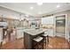 Bright kitchen with granite island, ample cabinetry, and hardwood floors at 2087 Yellowstone Dr, Fort Mill, SC 29707