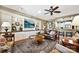 Living room with built-in shelving, hardwood floors, and a comfortable seating arrangement at 2087 Yellowstone Dr, Fort Mill, SC 29707